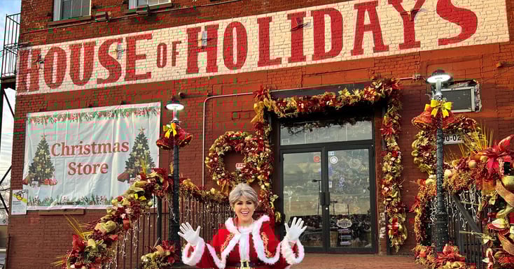 house of holiday physical store and a woman dressed as mrs klaus