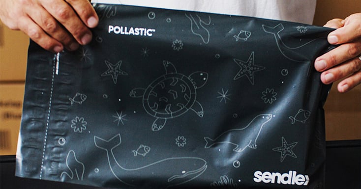 A man packing his items inside the POLLAST!C™ satchels by Sendle