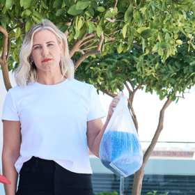 woman holding plastic waste