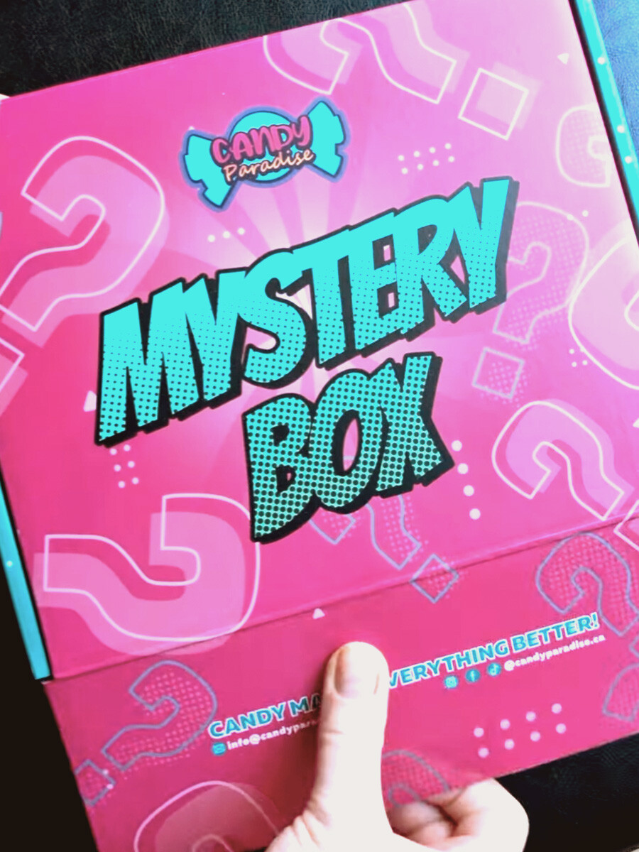 candy paradise mystery box hand about to unbox