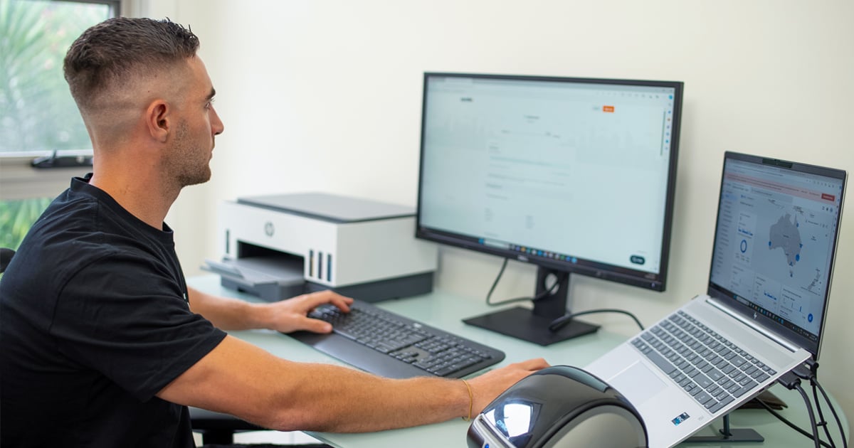 andres working on a computer showing sendle and shipstation website