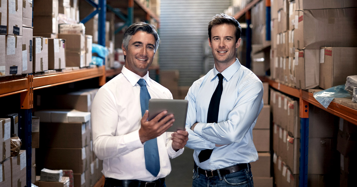 Two business men in a warehouse