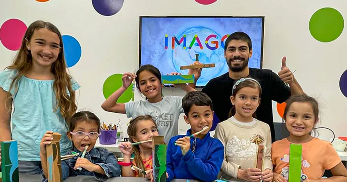 Happy children learning about simple switch between plastic and bamboo toothbrush