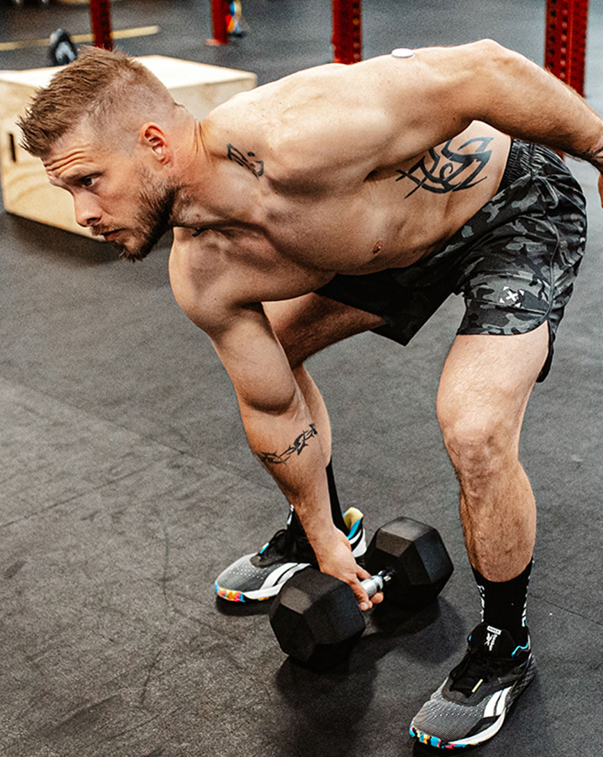 A male athlete using a dumbell for workout