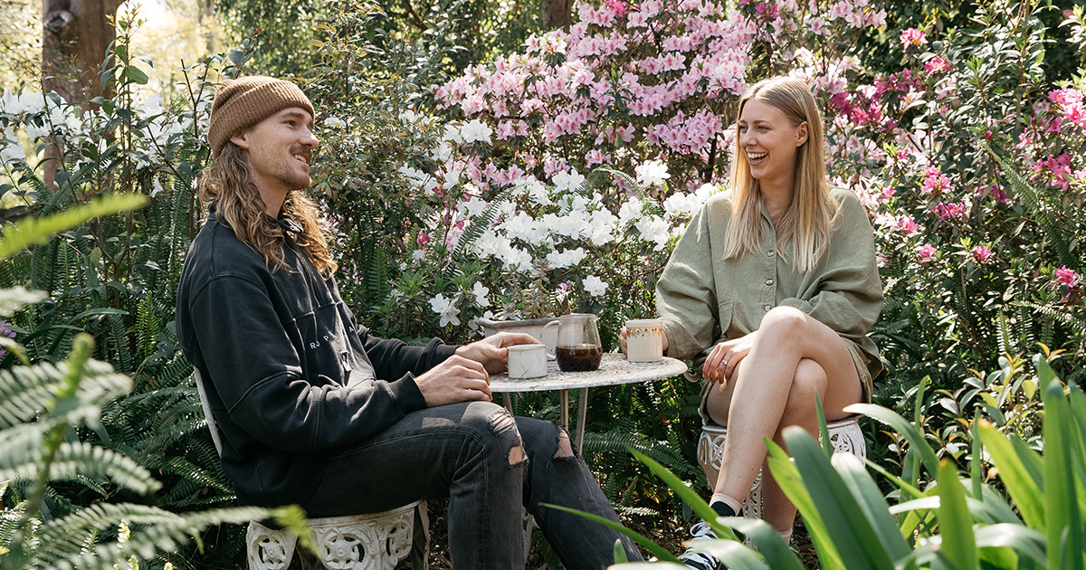 two people relaxing outside in the garden ellie lowe candid image