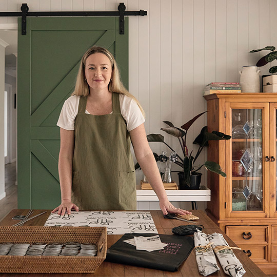 Little Farm Plot small business woman packing her poducts before shipping