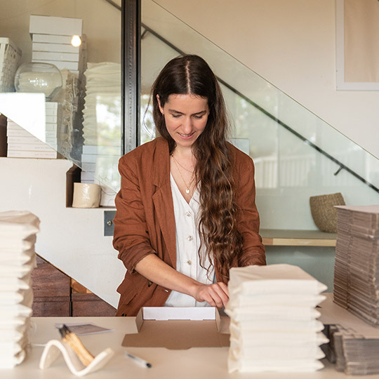 The Honest Jones long hair woman packing wrapping packages products