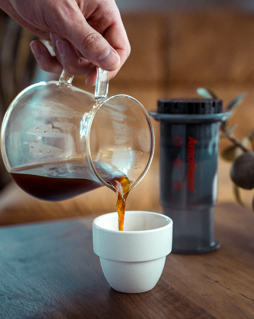 cafe fabrique pouring espresso on cup