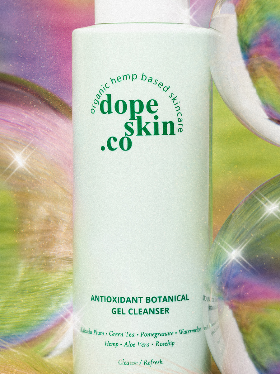 dope-skin-co-skin-care-gel-cleanser-bottle-surrounded-by-colorful-bubbles