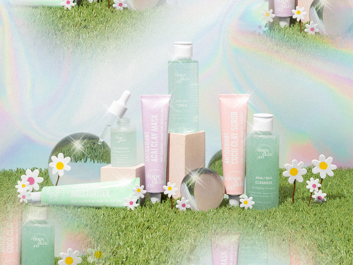 set-of-skin-care-products-on-top-of-grass-flowers-sparkling