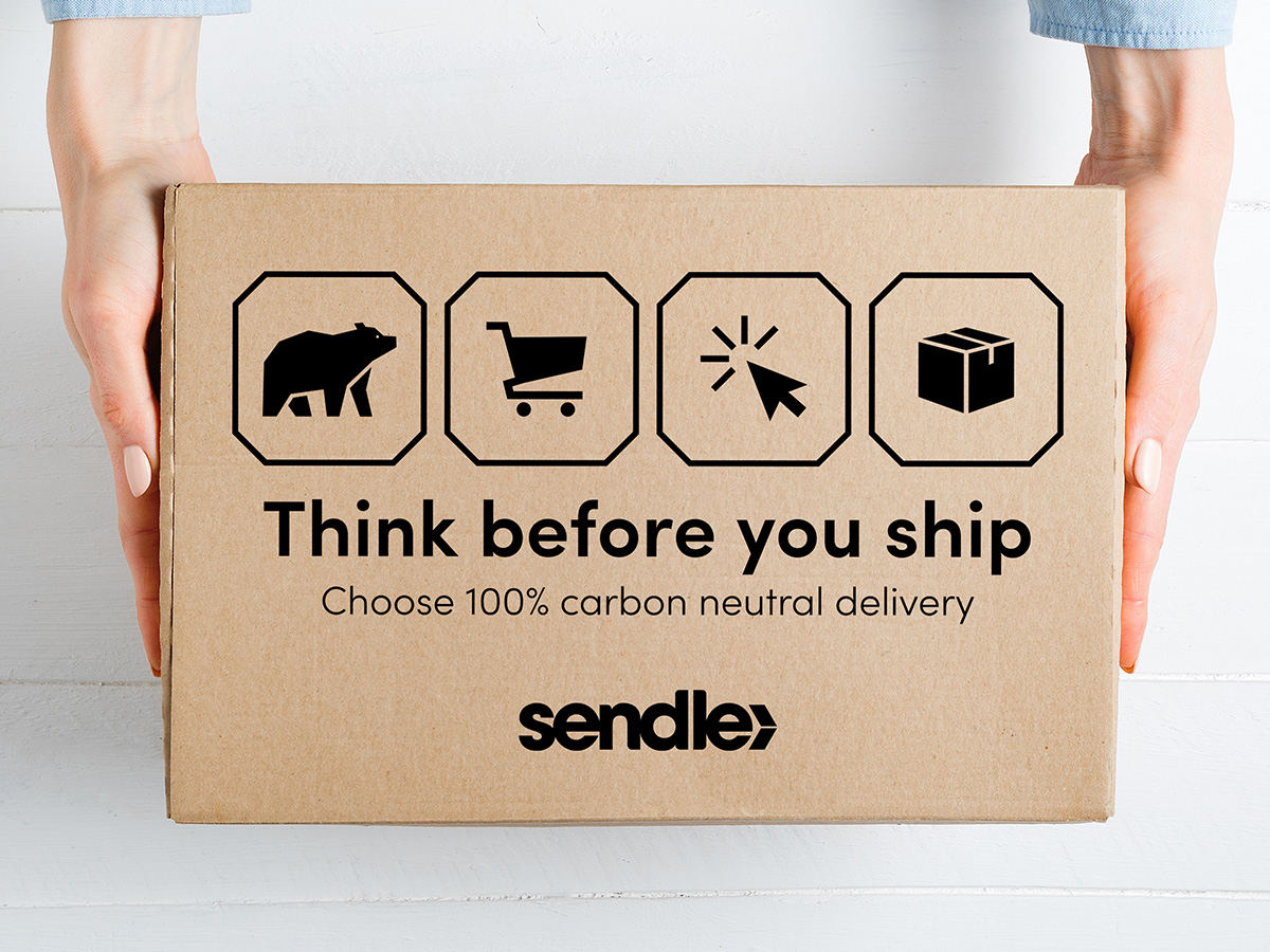 cardboard box with print think before you ship choose 100% carbon neutral delivery  sendle earth day 2022