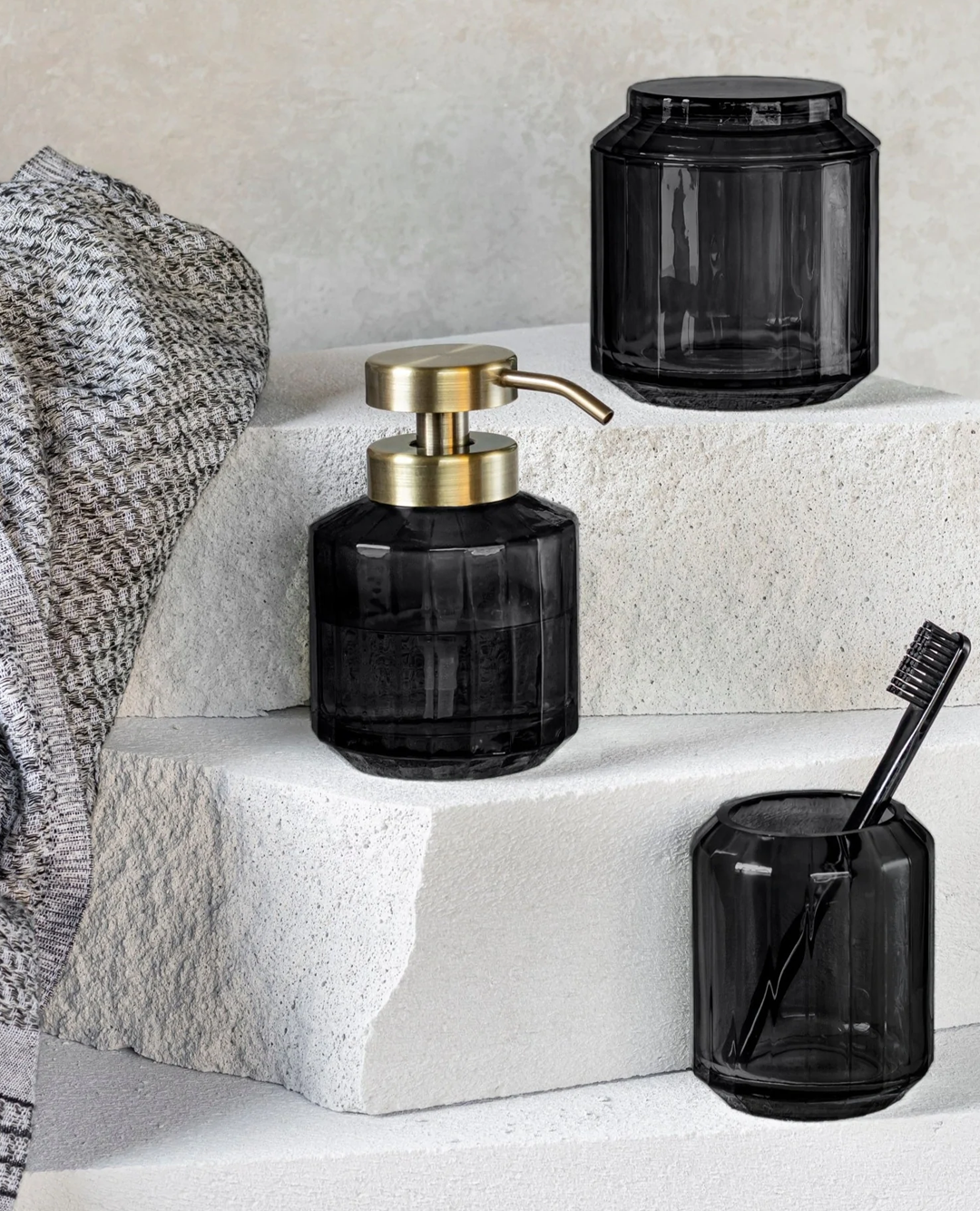gray towel, black jar containers for your bathroom counter
