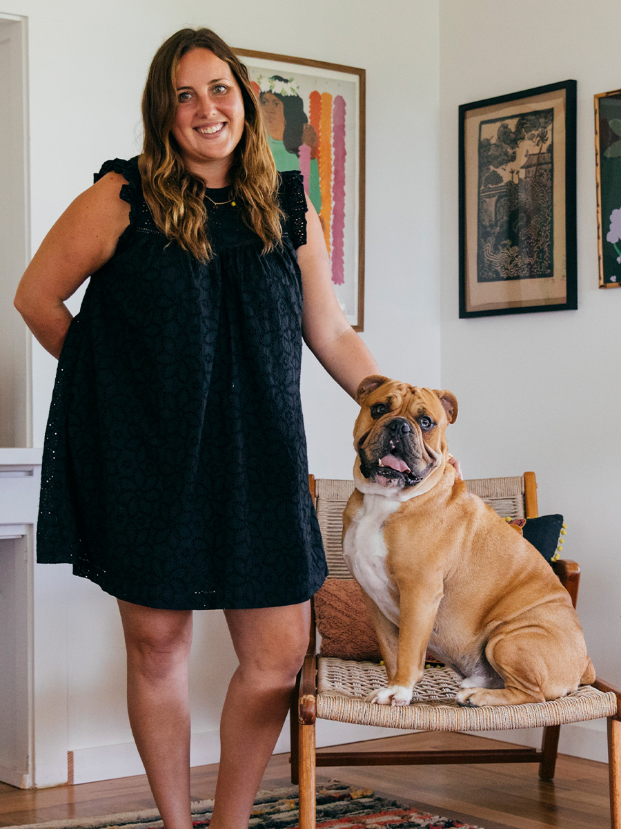 pali swim co-founder martha duerr standing beside her dog