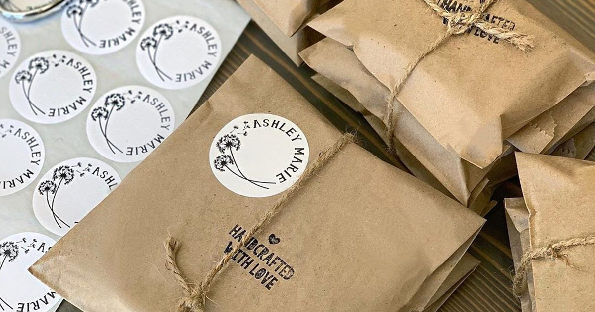 branded stickers on brown packaging paper with ribbon by ashley marie soap