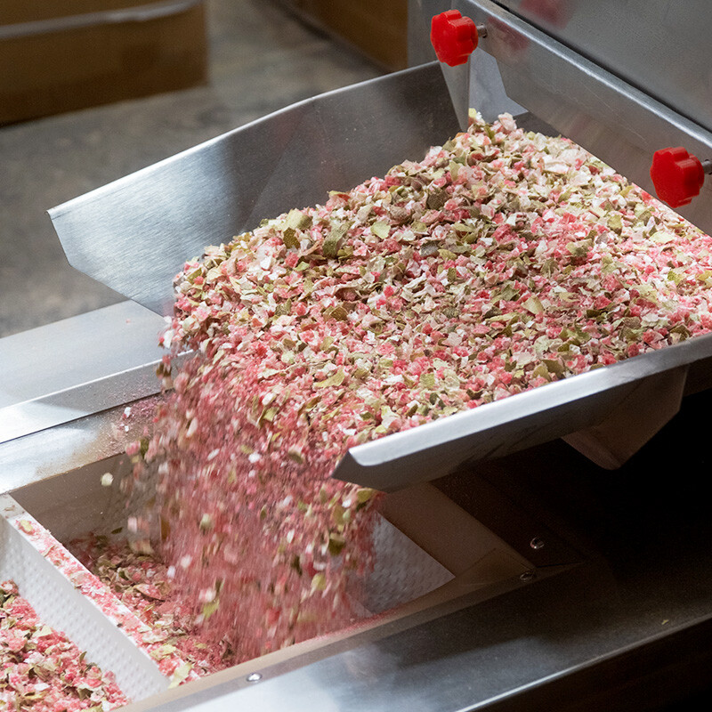 loose leaf tea being shifted in machine