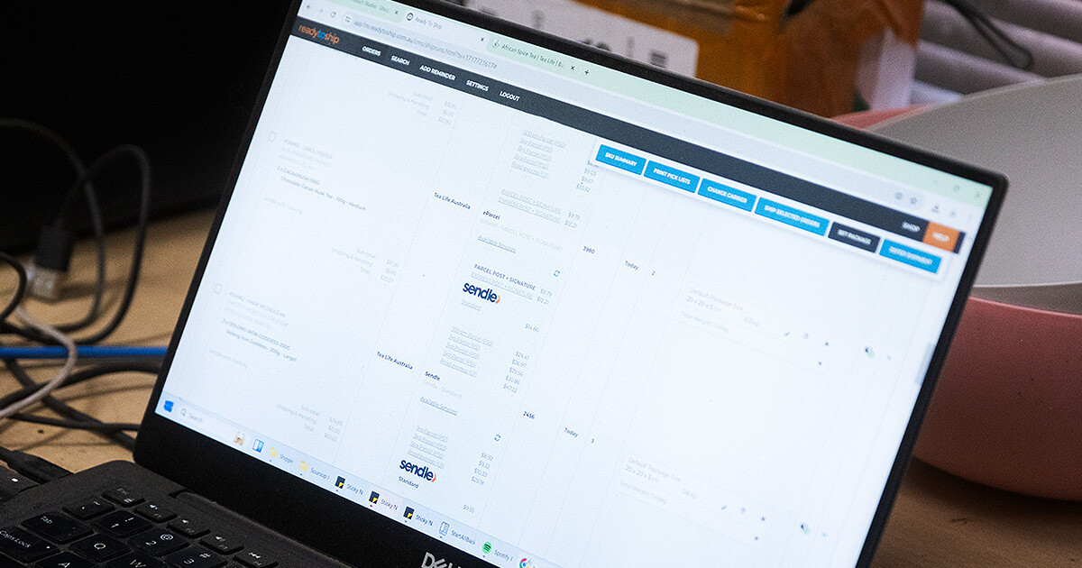 tea life computer showing Ready to ship website and sendle