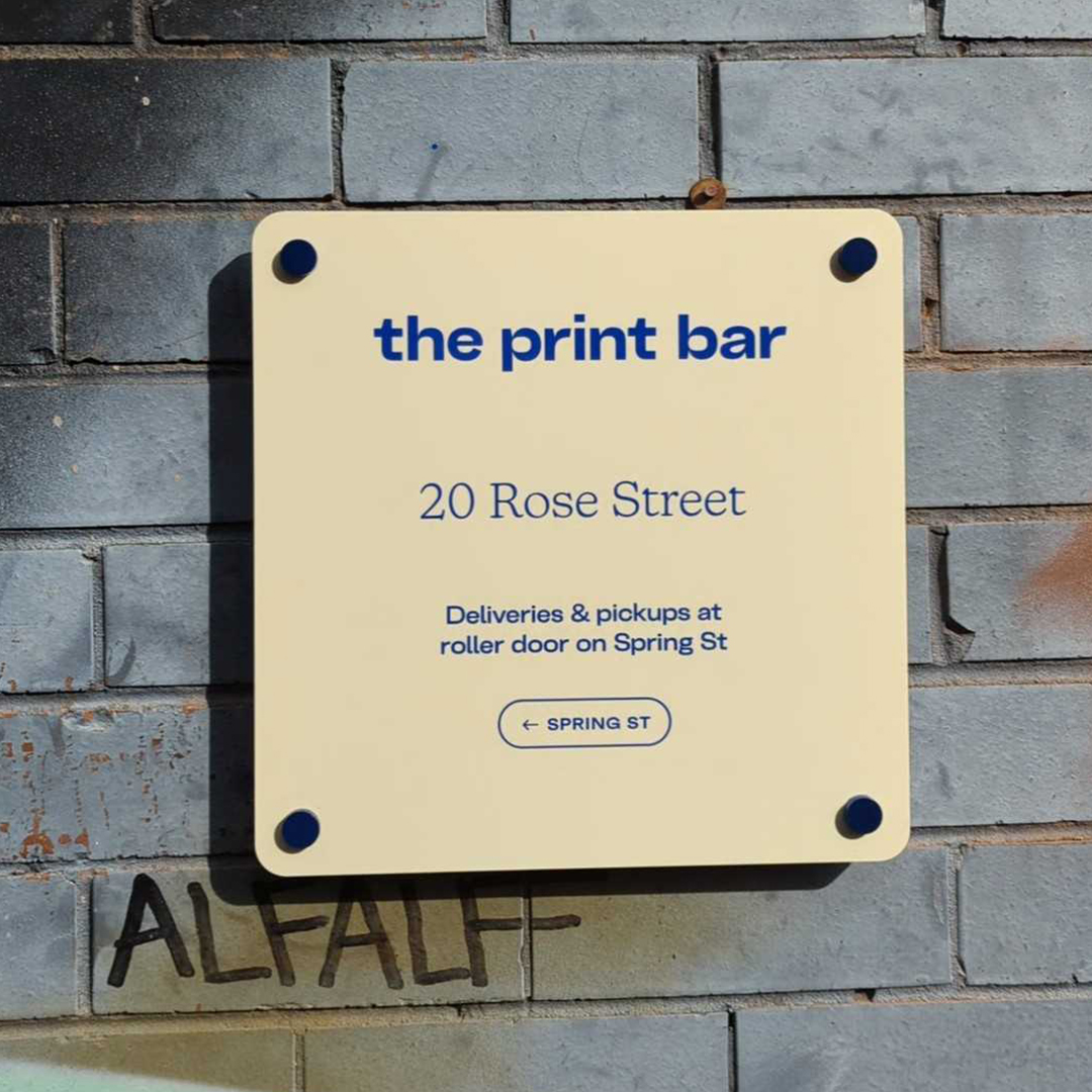 the print bar street sign