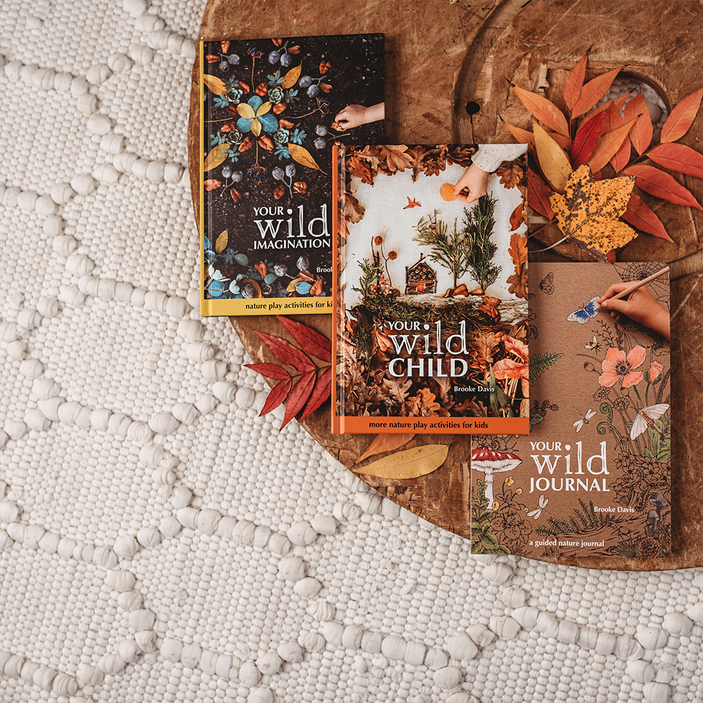 a variety of books by your wild books spread on the table