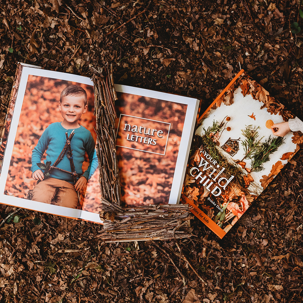 an open childrens activity book on the ground by your wild books