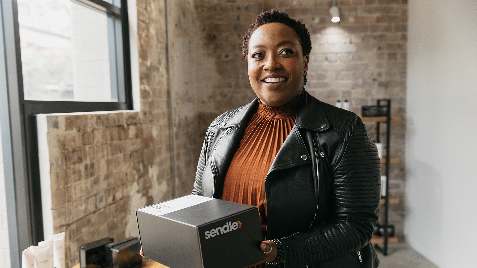 sendle image of black woman female business owner who ships sustainably